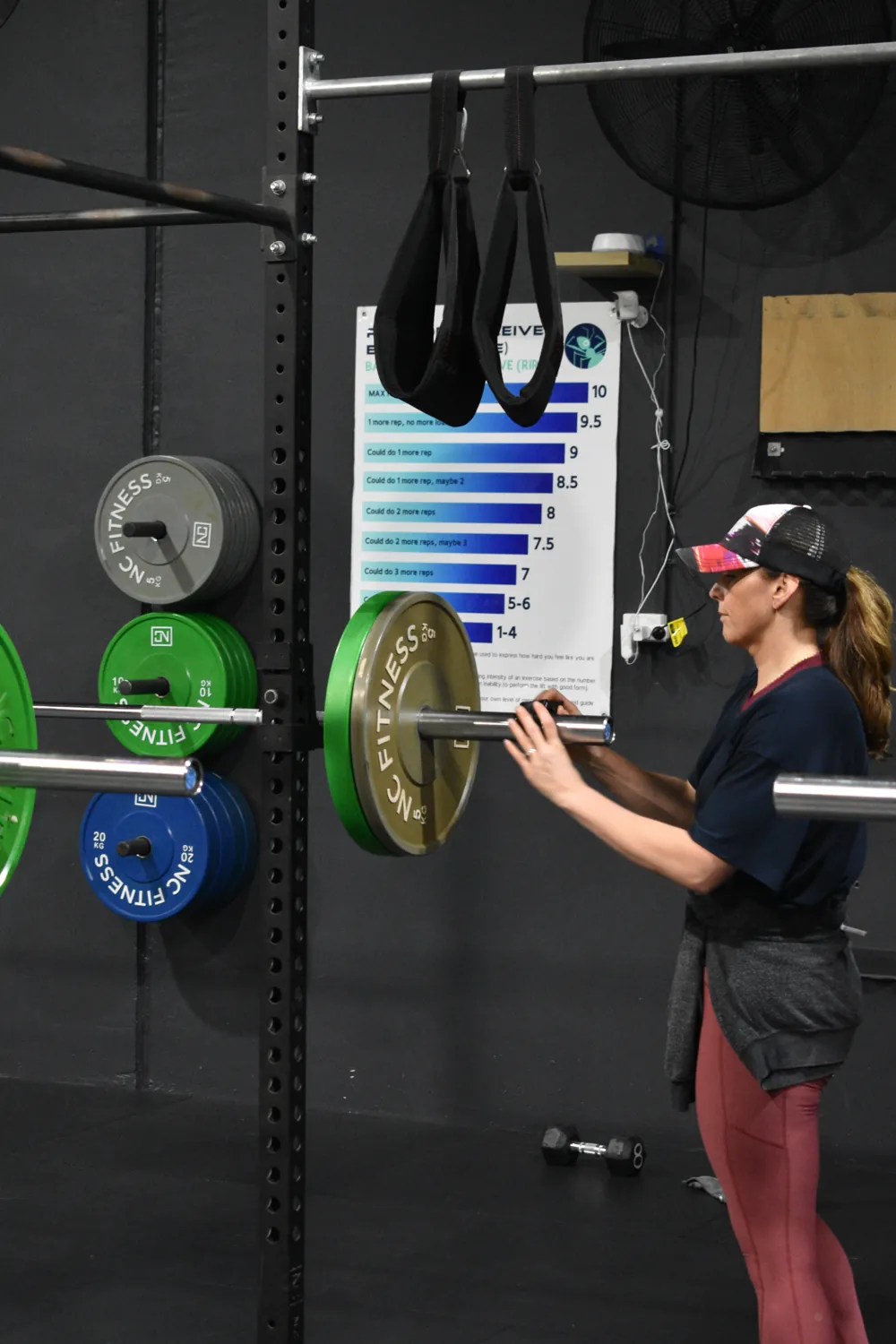 Coach working with a member at the rack