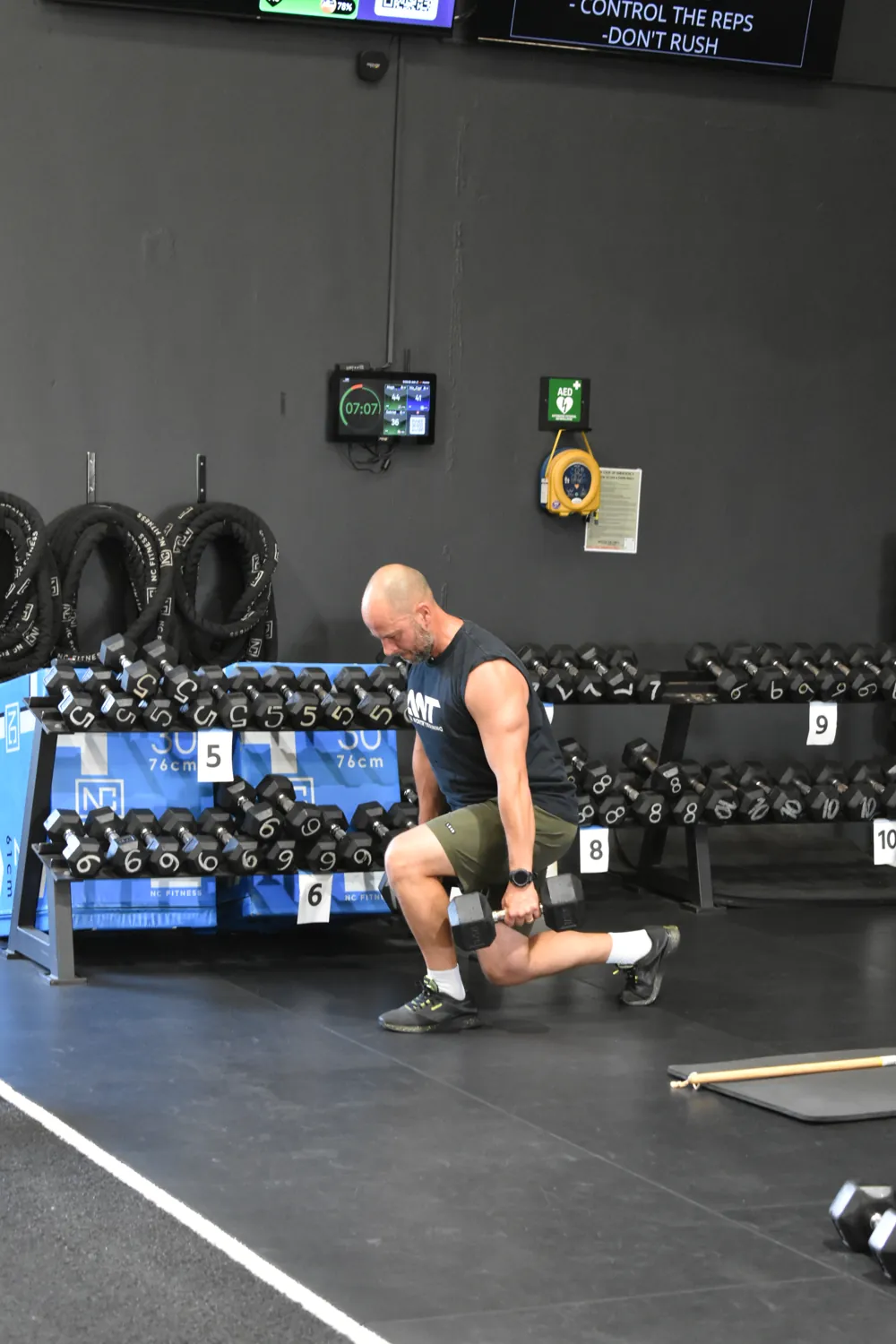 Coach checking in with a member mid-session